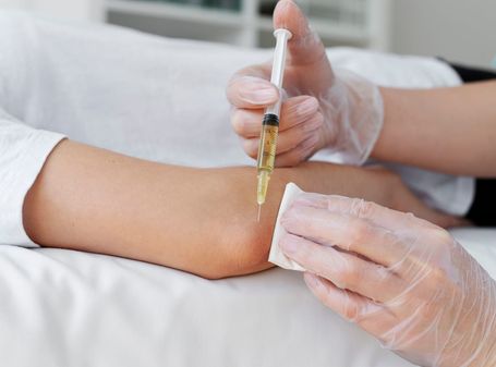 Patient receiving a joint injection for arthritis pain relief